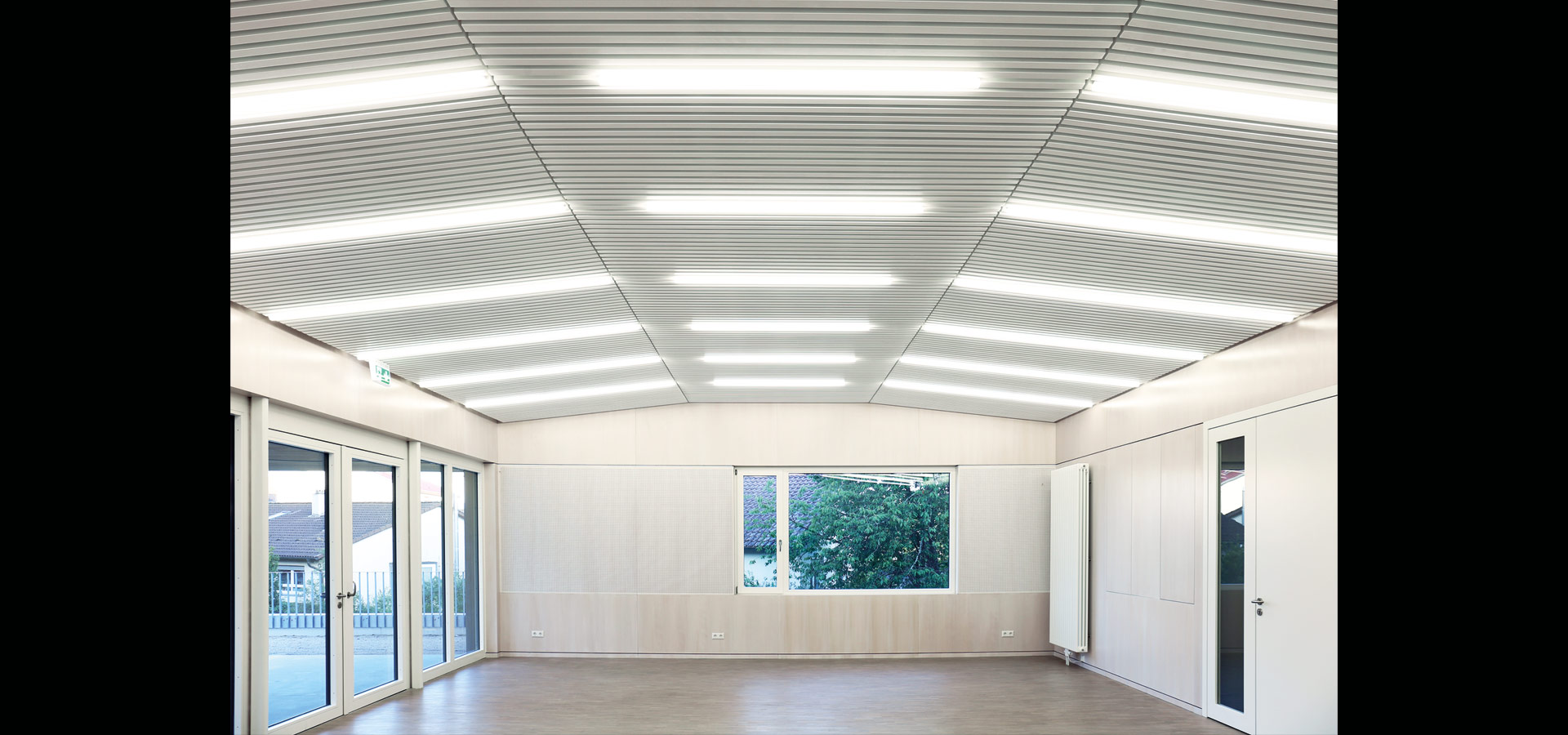 Luxsystem led luminaire lines of light community hall huchenfeld